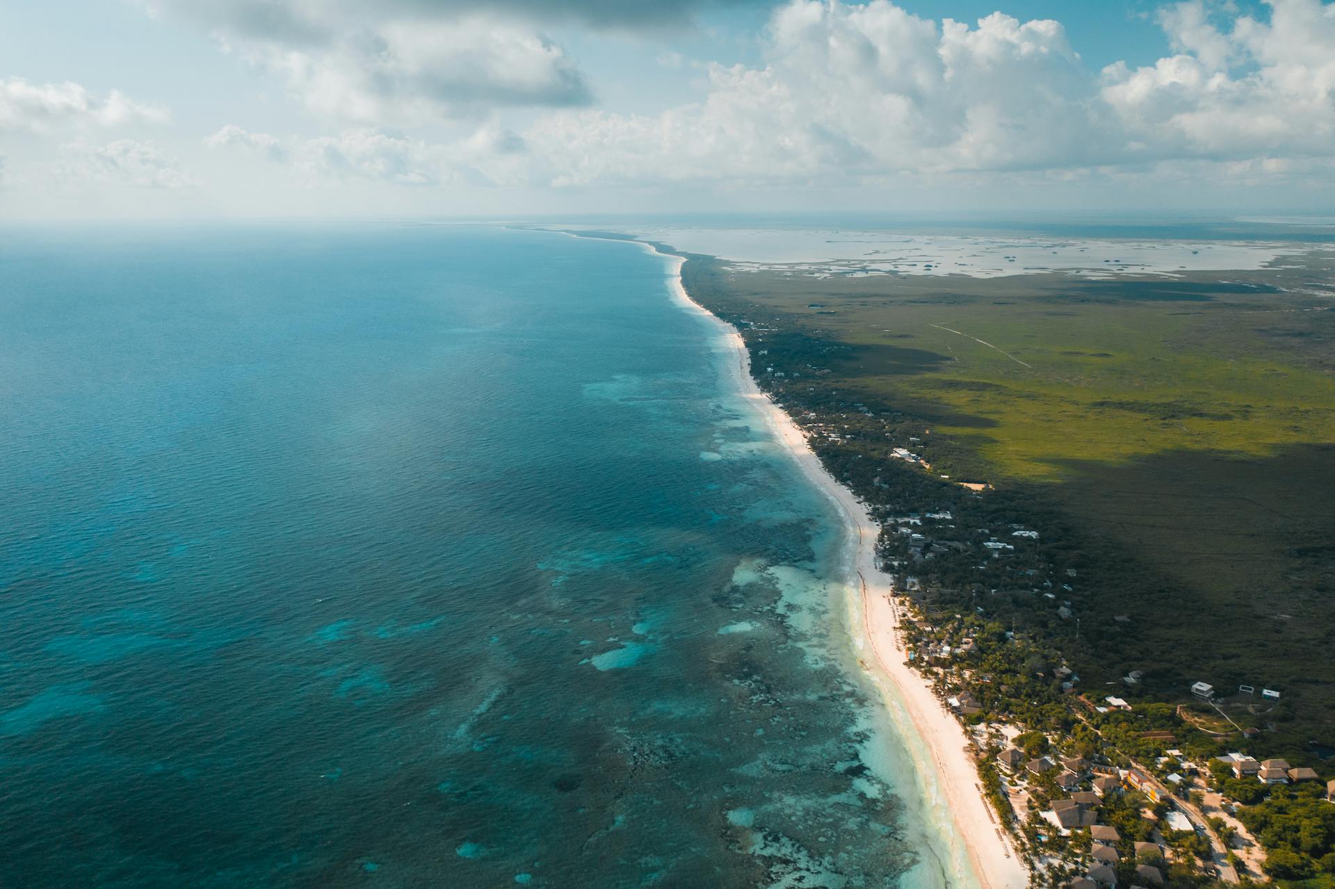 Aerial View of Blue Sea Under Blue Sky