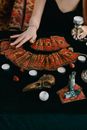 A Person Sitting at the Table with Cards