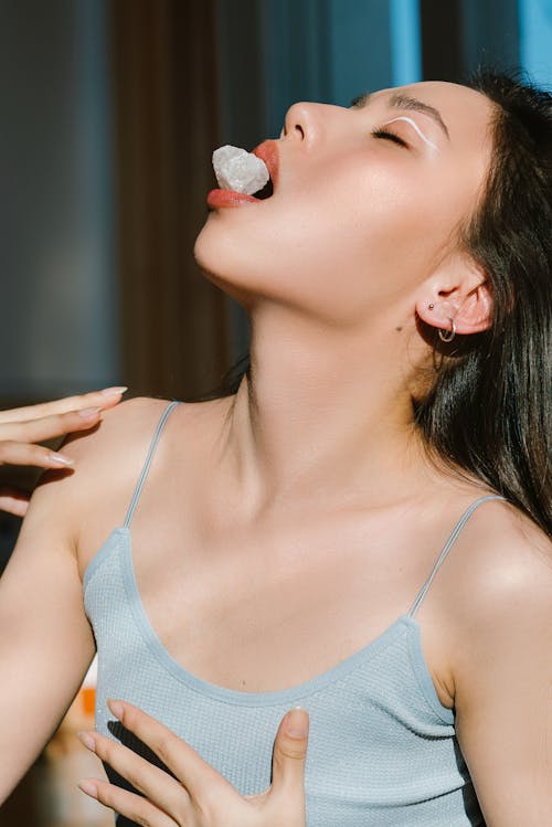 Woman with Gemstone on Mouth