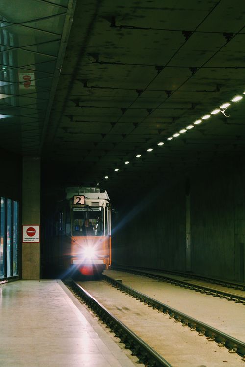Free A vintage tram arrives at an underground platform in Budapest, showcasing urban transportation. Stock Photo