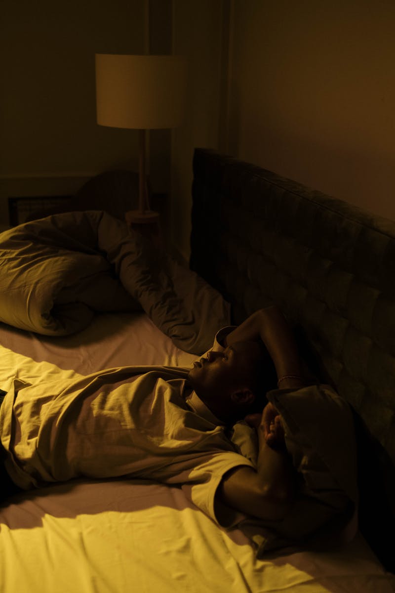 Peaceful person sleeping in comfortable bed