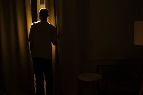 Silhouette of Man Suffering From Insomnia