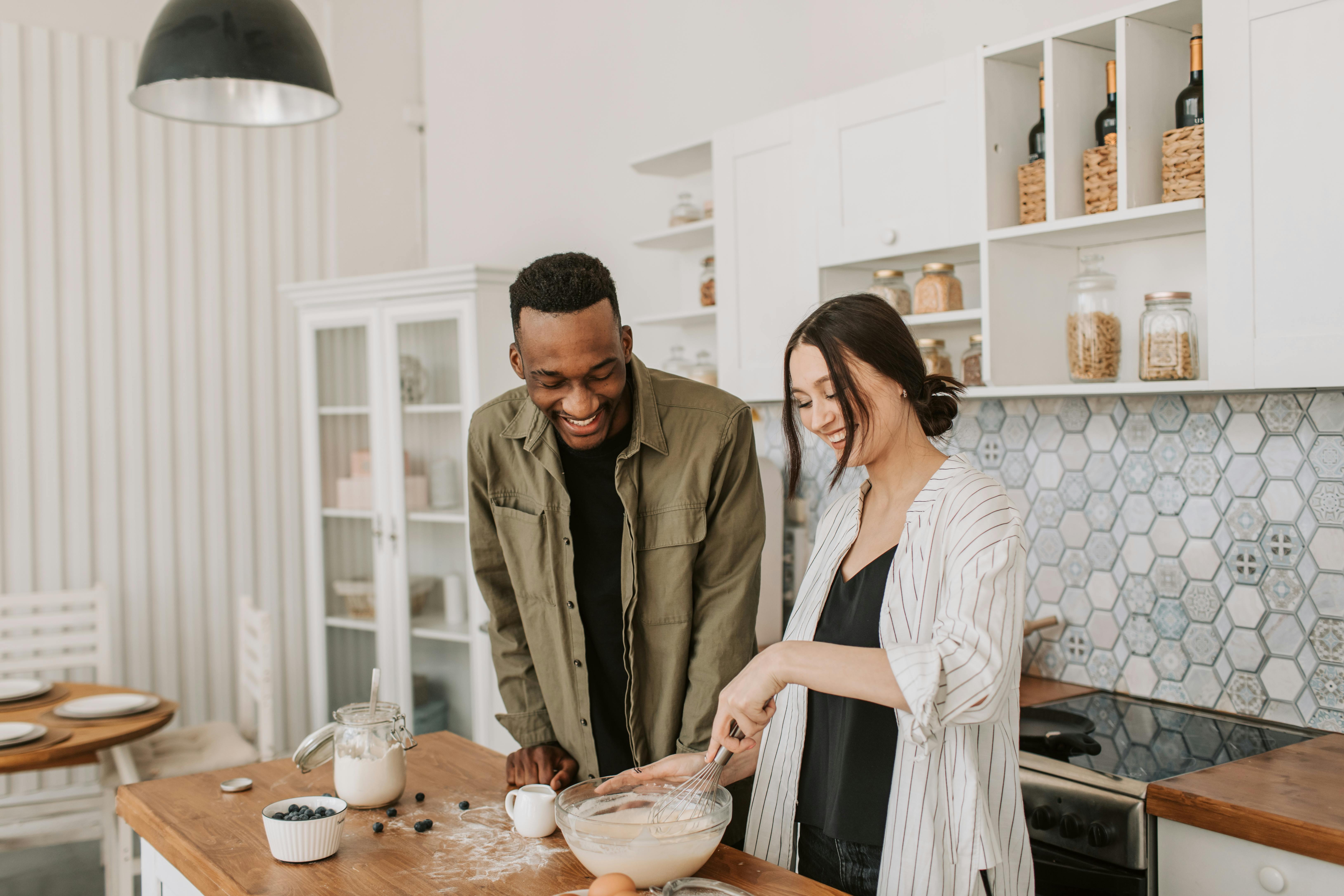 a couple making a pancake batter