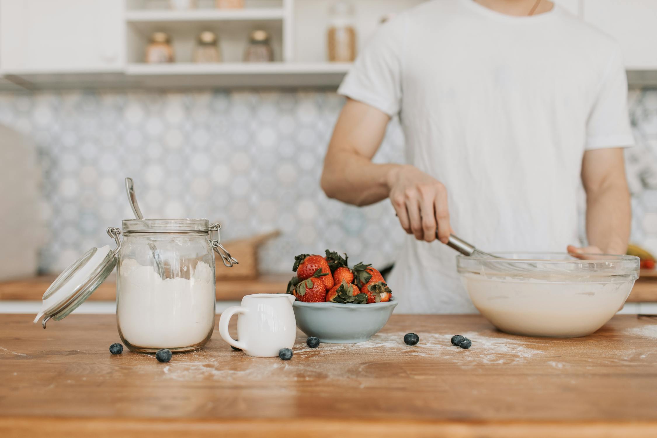 A Man Whisking a Pancake Batter