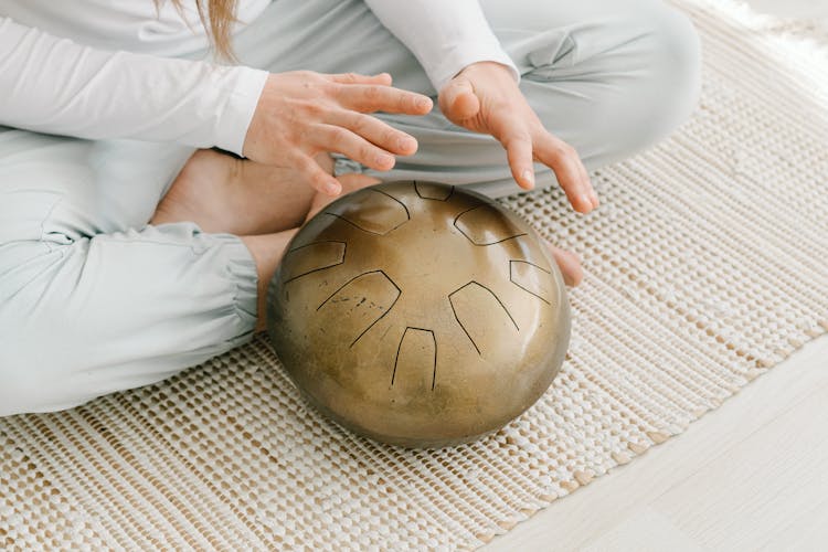 A Person Playing Steel Tongue Drum