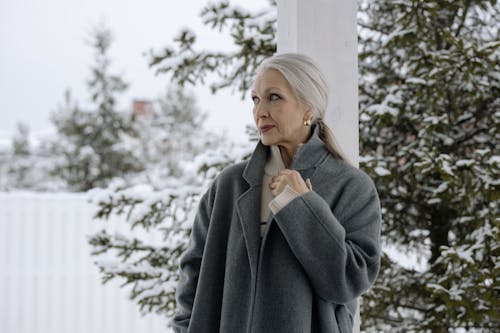 Elegant Elderly Woman in Gray Coat