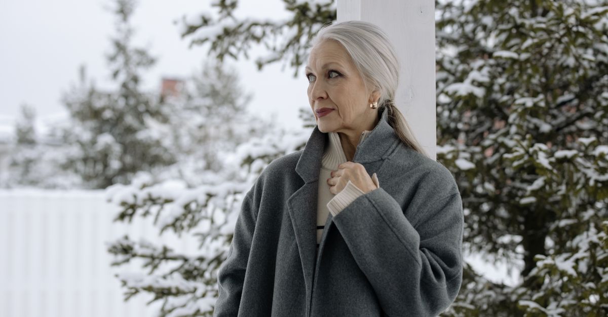 Elegant mature woman in gray winter coat