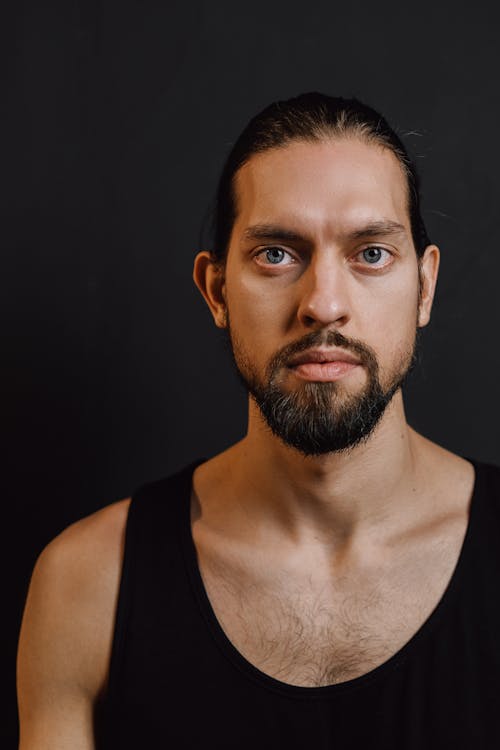 A Bearded man Wearing a Black Tank Top