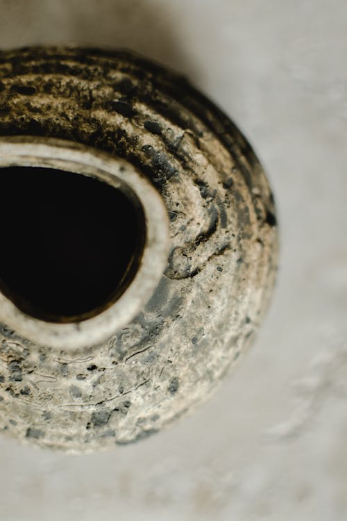 Gray and Black Ceramic Jar in Close Up Shot