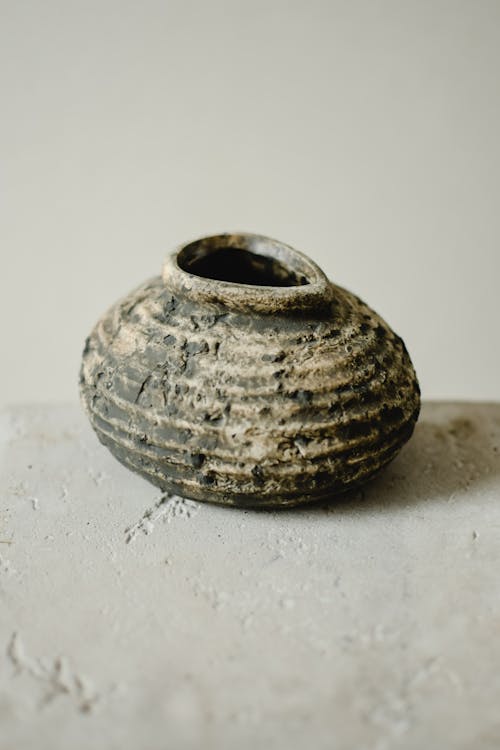 Gray and Brown Ceramic Jar in Close Up Shot