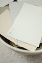 White Printer Paper on Gray Plastic Container