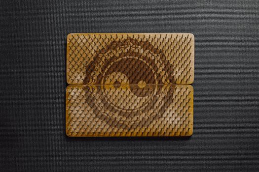 Nails on Wooden Board with the Ying Yang Symbol