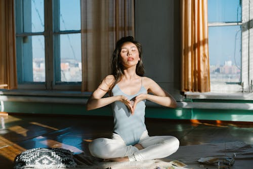 Free Asian woman with stone practicing meditation Stock Photo