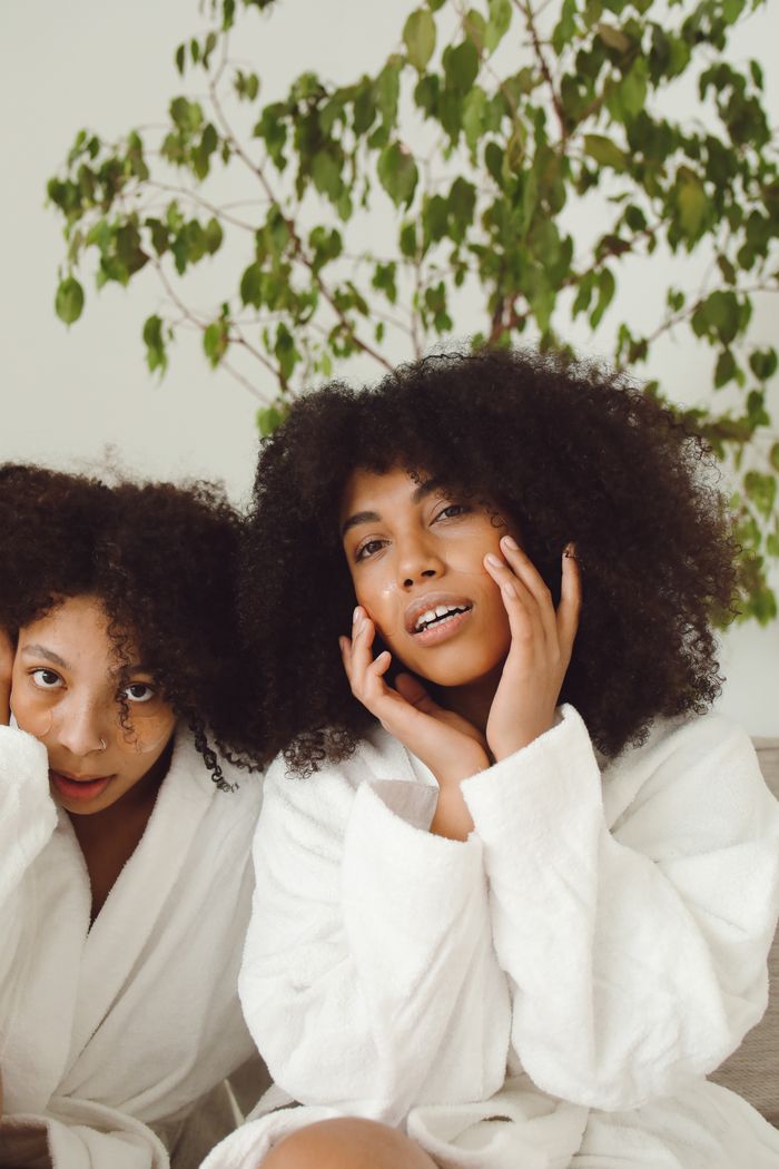 Women enjoying VelourCap hair care routine