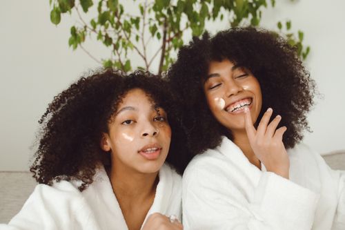 Free Two women enjoying a skincare routine, showcasing happiness and natural beauty. Stock Photo