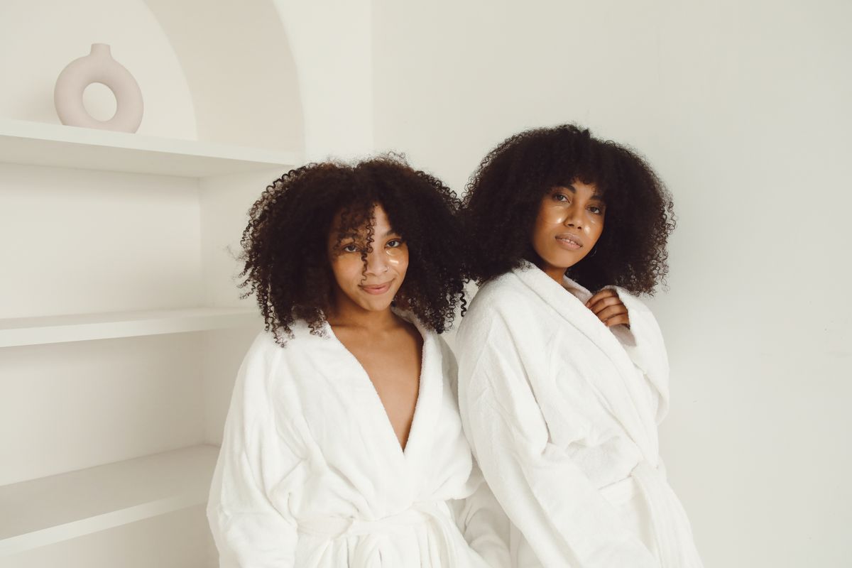 Friends in robes posing at a spa day