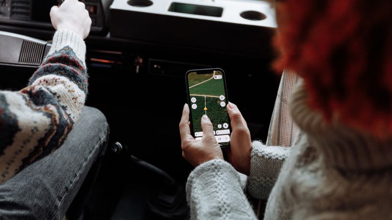 driver using a smartphone app to start a public EV charging session