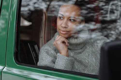 A Woman Sitting inside the Van