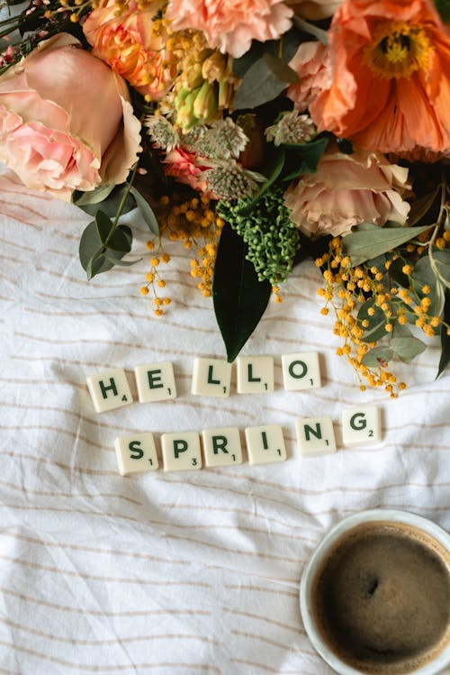 Scrabble Tiles near Flowers