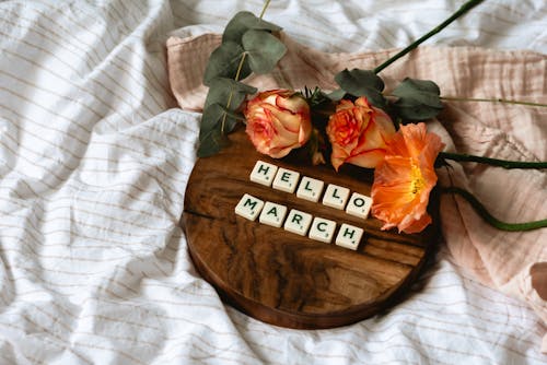 Close-Up Shot of Scrabble Tiles on a Wooden Tray
