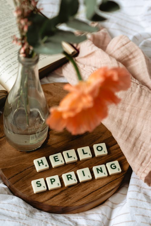 Close-Up Shot of Scrabble Tiles on a Wooden Tray