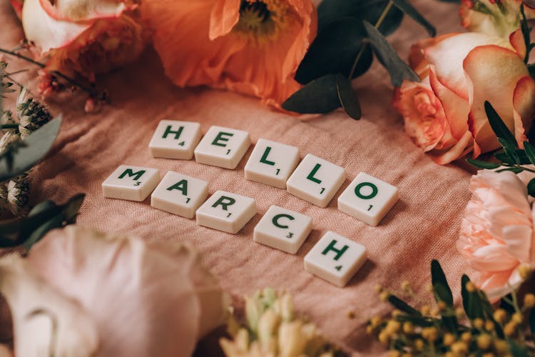 Scrabble Tiles On Pink Surface