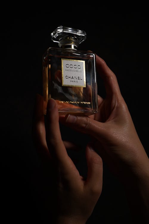 Close-up of Holding a Bottle of Perfume