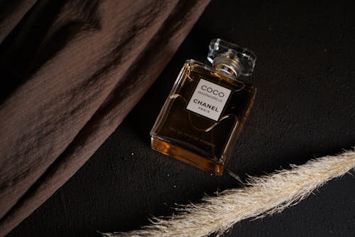 Free Perfume Bottle on Black Surface Stock Photo