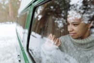 Man in Gray Sweater in Car