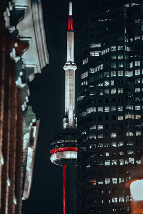 Free Dramatic night shot of CN Tower and skyscraper, Toronto, Canada. Stock Photo
