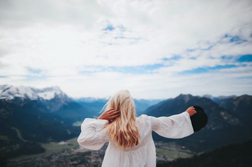 Back View of a Woman Wearing White Dress