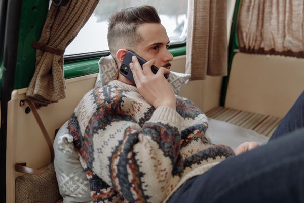 A man taking a call at home. Photo by Thirdman on Pexels