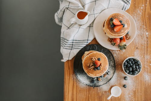 A Flatlay of Pancakes with Strawberries and Blueberries