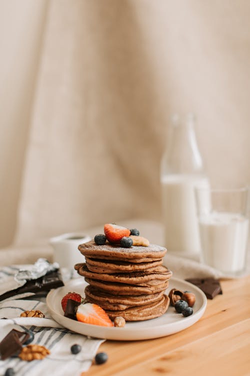 Free Pancakes with Fruit Toppings on a Plate Stock Photo