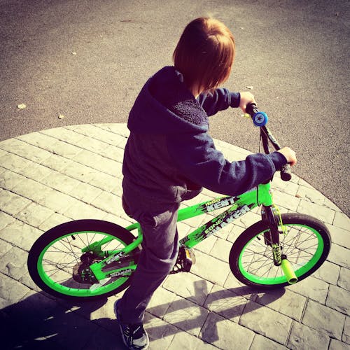 Boy Riding Bike at Daytime
