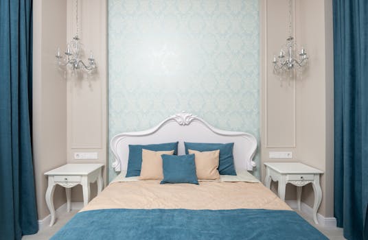 Bright blue bedroom with wallpaper