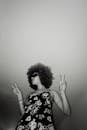 Grayscale Photo of an Afro-Haired Woman in Floral Dress with Sunglasses Posing