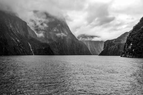 Lake With Mountains Under A Cloudy Sky