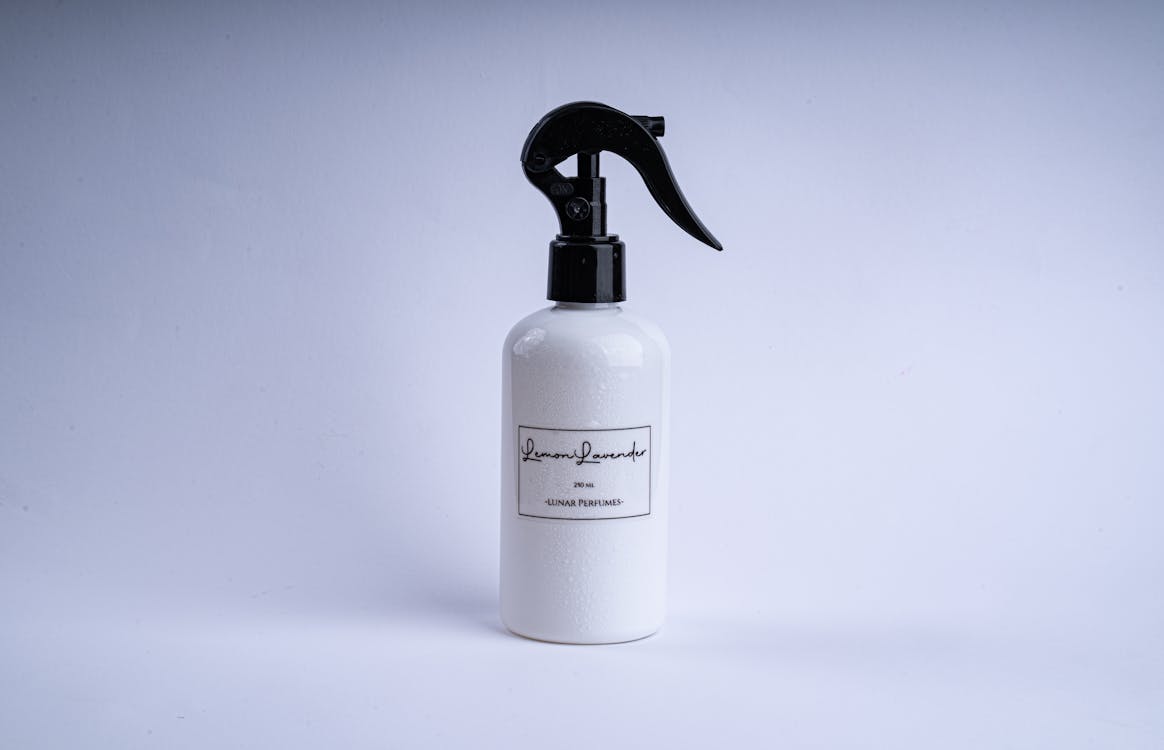 Free Perfume In White Spray Bottle Stock Photo