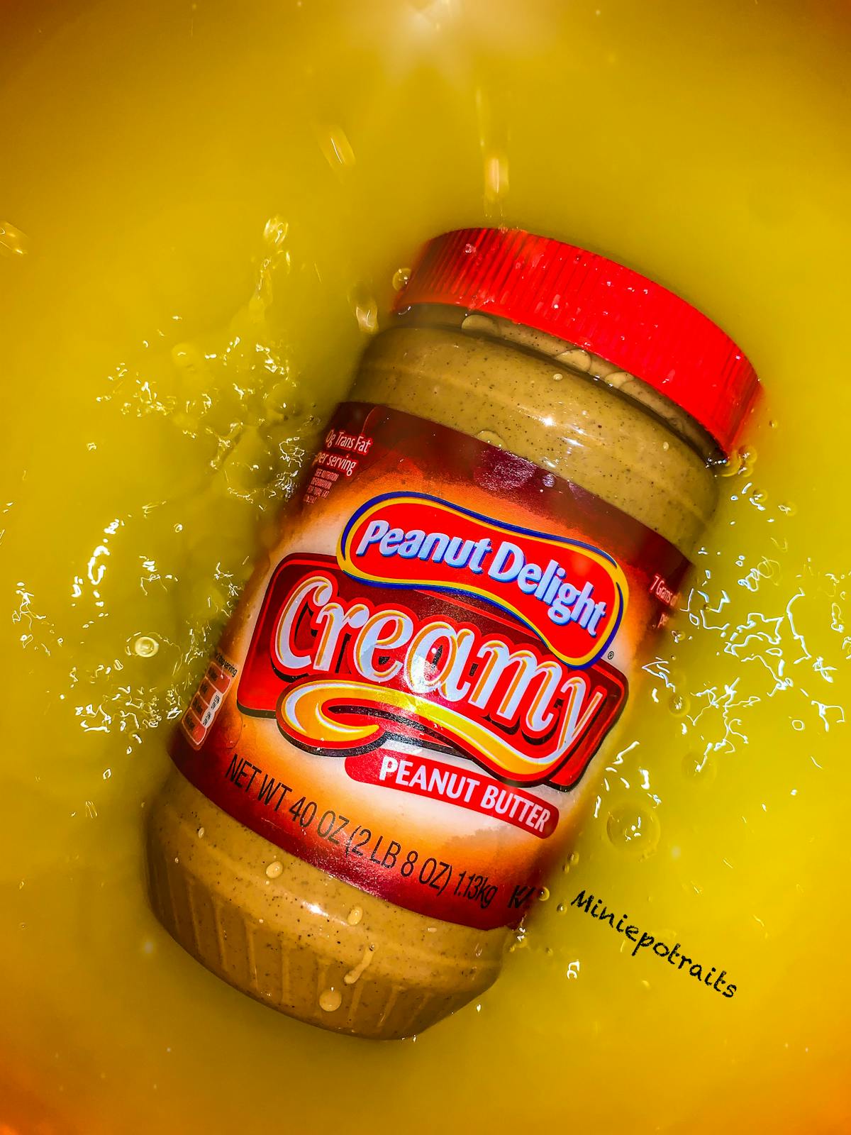 Person journaling food intake with a healthy meal and water on a table