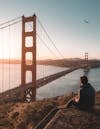 Free A Person Sitting near the Golden Gate Bridge Stock Photo