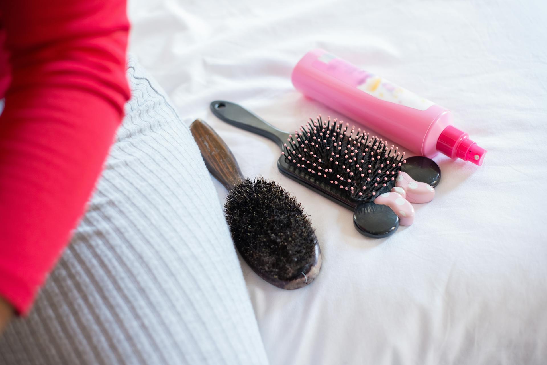 Close Up Photo of Hair Brushes