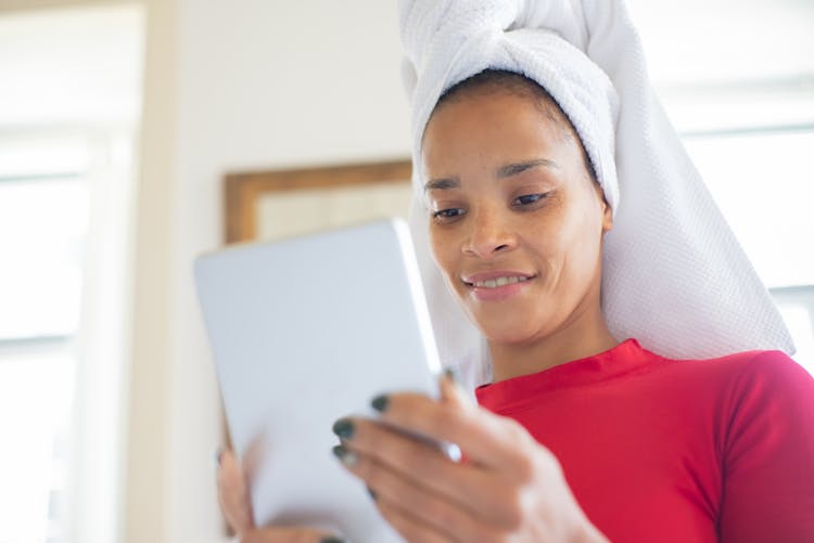 Woman Looking  At A Tablet