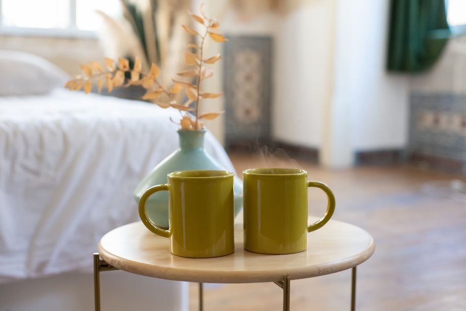 kitchen counter, bedroom dresser, or entry table at home coffee mug phone keys lifestyle photo 1