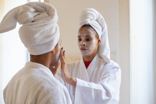 A mother and daughter enjoying a relaxing spa day with facial treatments and bathrobes.
