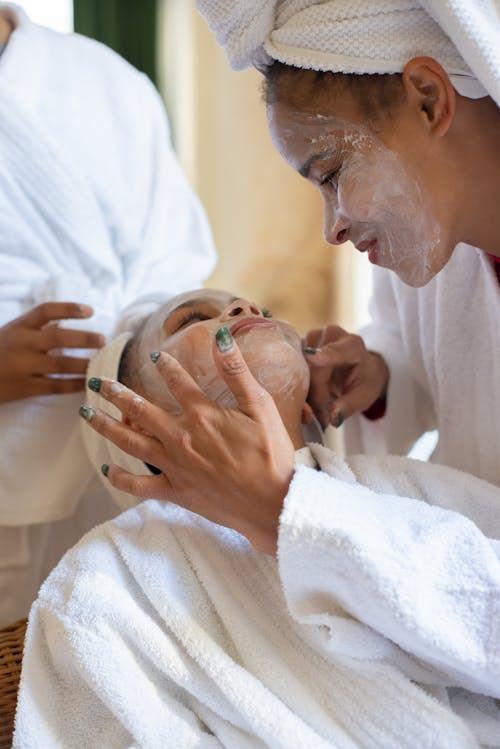 Women Applying Face Cream