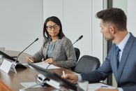 Professional Woman looking at Colleague