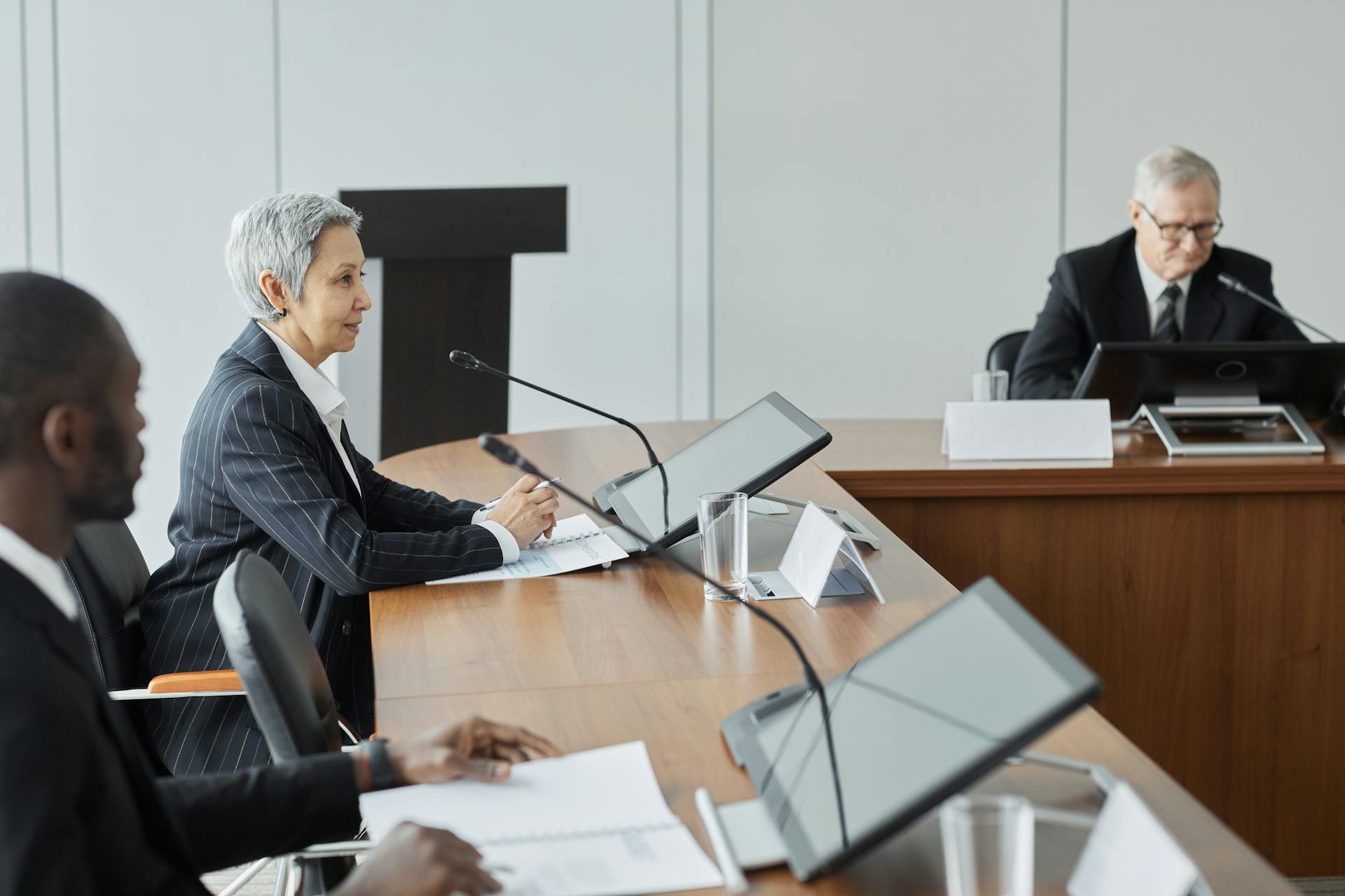 Executives in a conference room engaging in a professional business meeting.