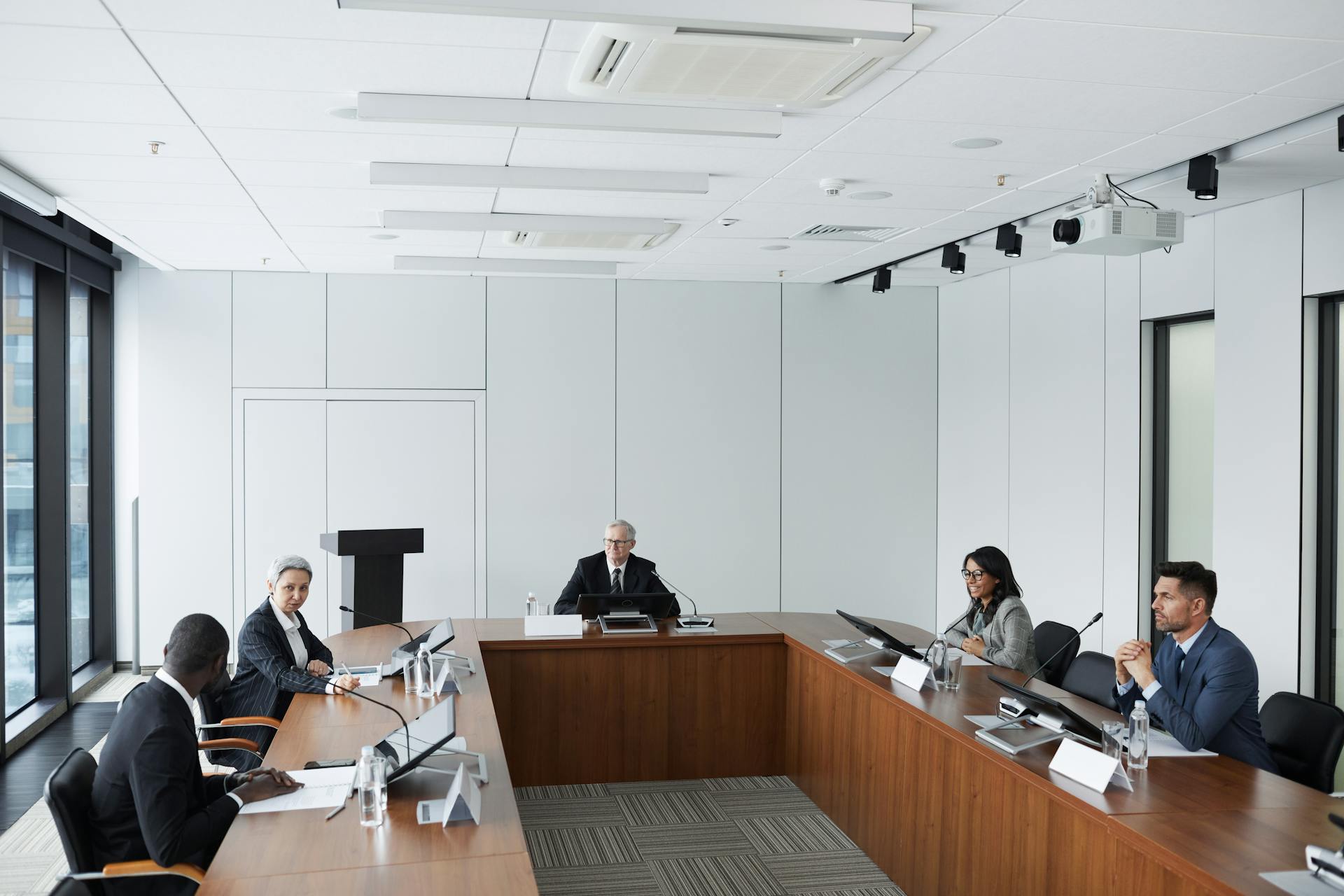 Multicultural business team in a conference room discussing strategies.