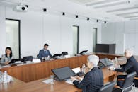 People Sitting at Conference Table